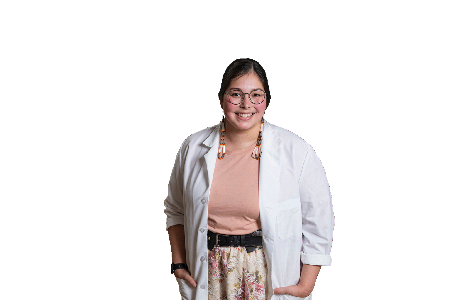 A transfer student wearing a white lab coat smiles